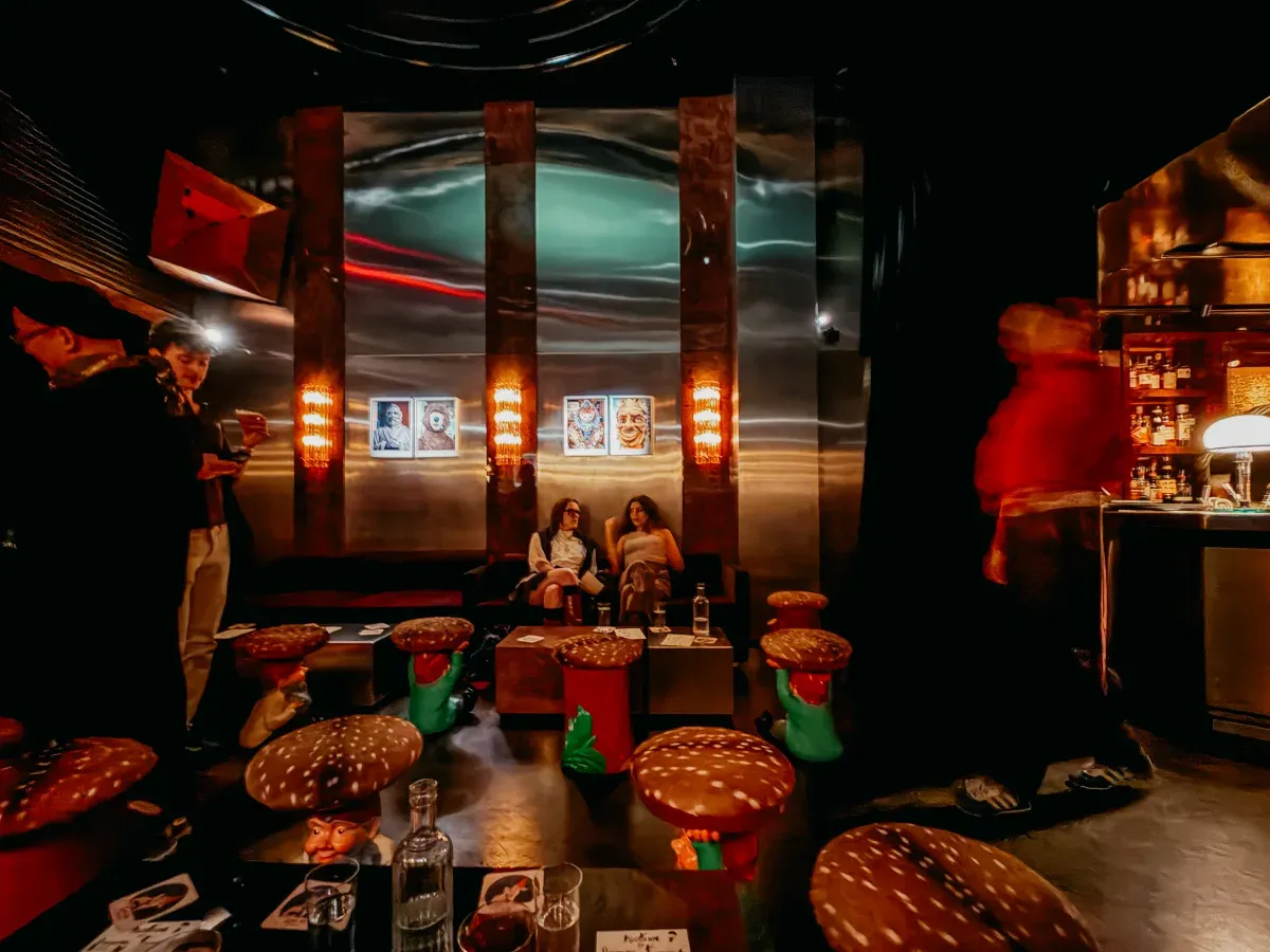 Gosh interior with metal walls and sculptural stools