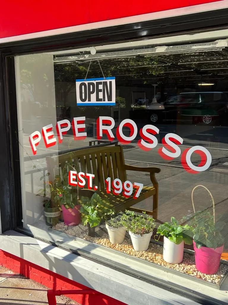 Pepe Rosso storefront window on Sullivan Street